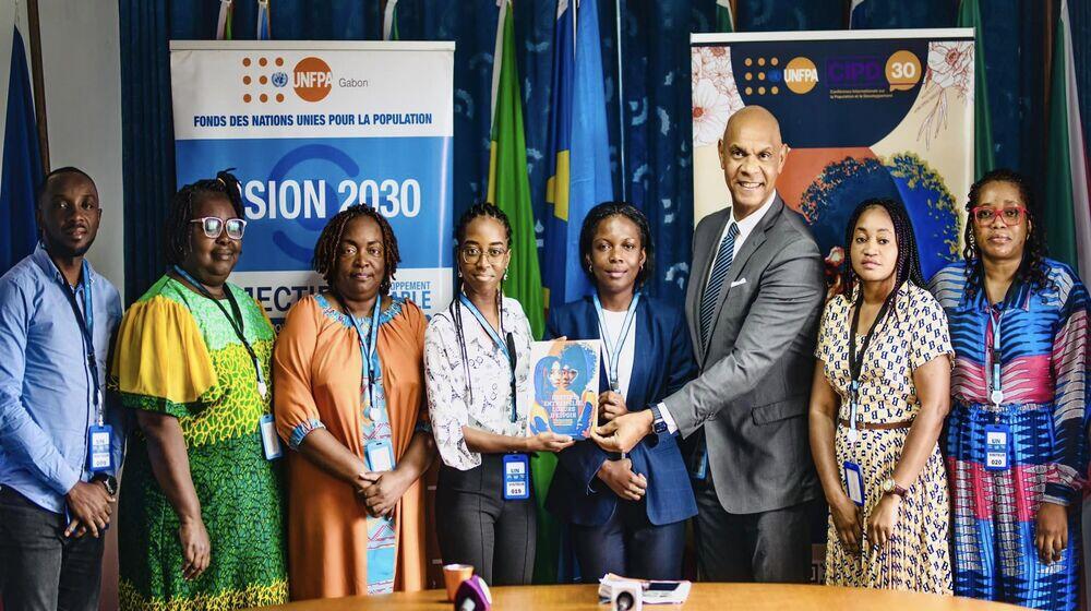 Representative accompanied by his team and participants at the launch.